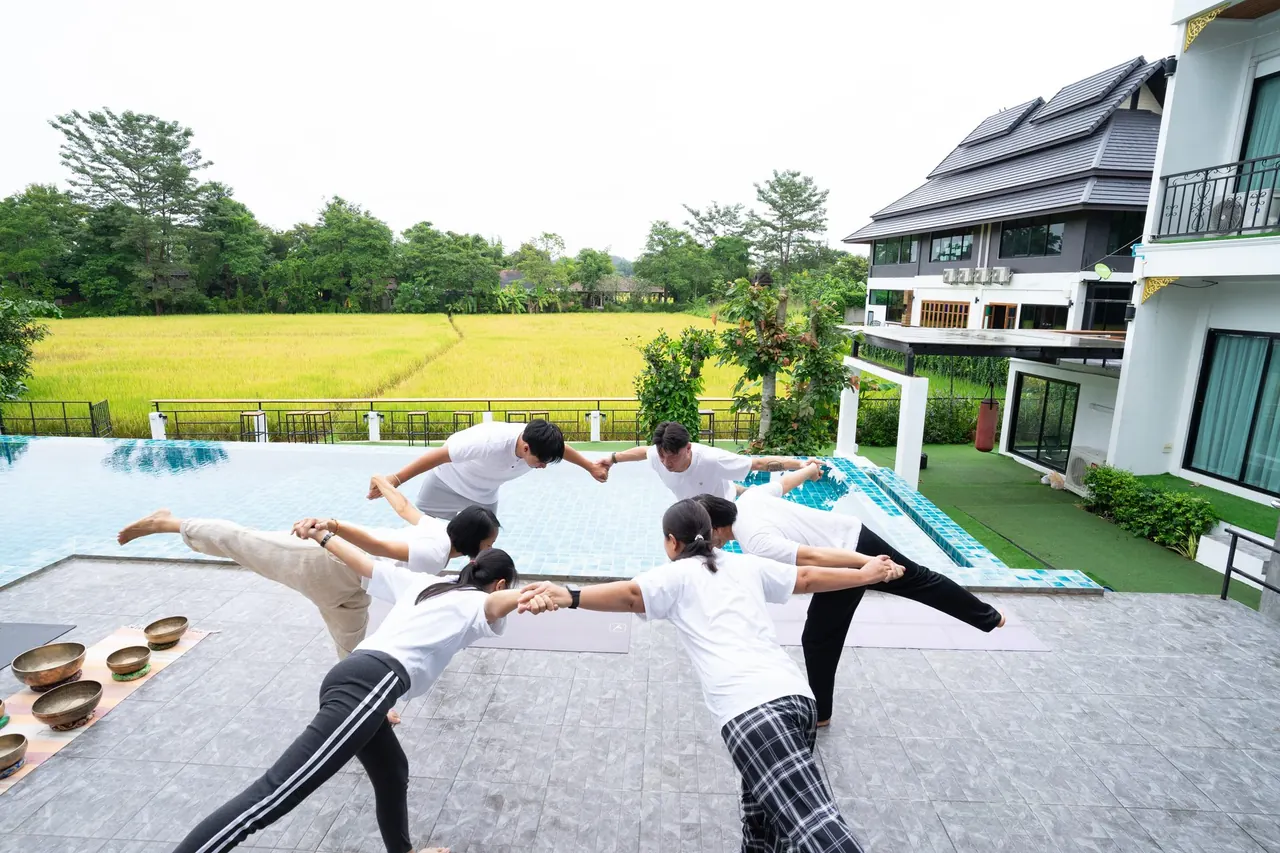 Guided stretching session by the pool at The Warmth Rehab
